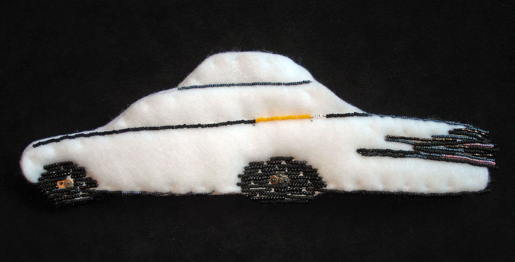 Semi-beaded NYC taxi cab. Bead embroidery on felt.
