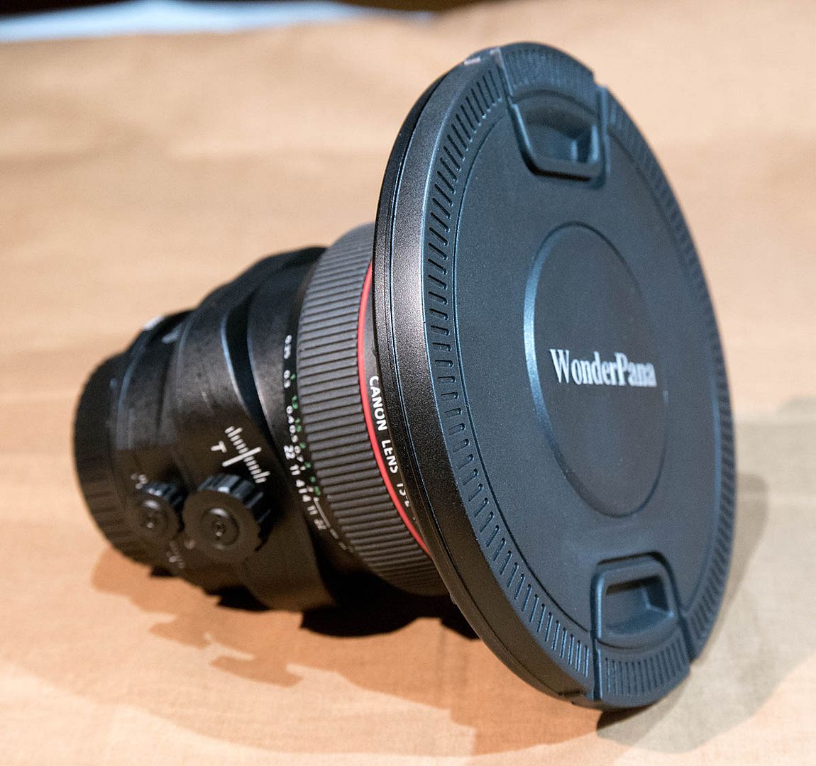 IMAGE: http://i89.photobucket.com/albums/k220/jeffreybehr/Samsung%20NX1/17mm%20TS-E%20lens%20and%20Fotodiox%20WonderPana%20filter/17TSE%20front%20w%20Fotodiox%20ring%20amp%20cap_1200w_zps6uikolkv.jpg