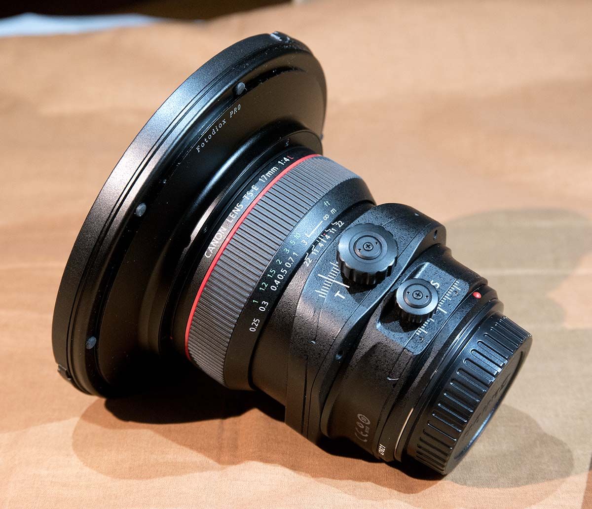 IMAGE: http://i89.photobucket.com/albums/k220/jeffreybehr/Samsung%20NX1/17mm%20TS-E%20lens%20and%20Fotodiox%20WonderPana%20filter/17TSE%20rear%20w%20Fotodiox%20ring%20amp%20cap_1200w_zpsr1oo99xn.jpg