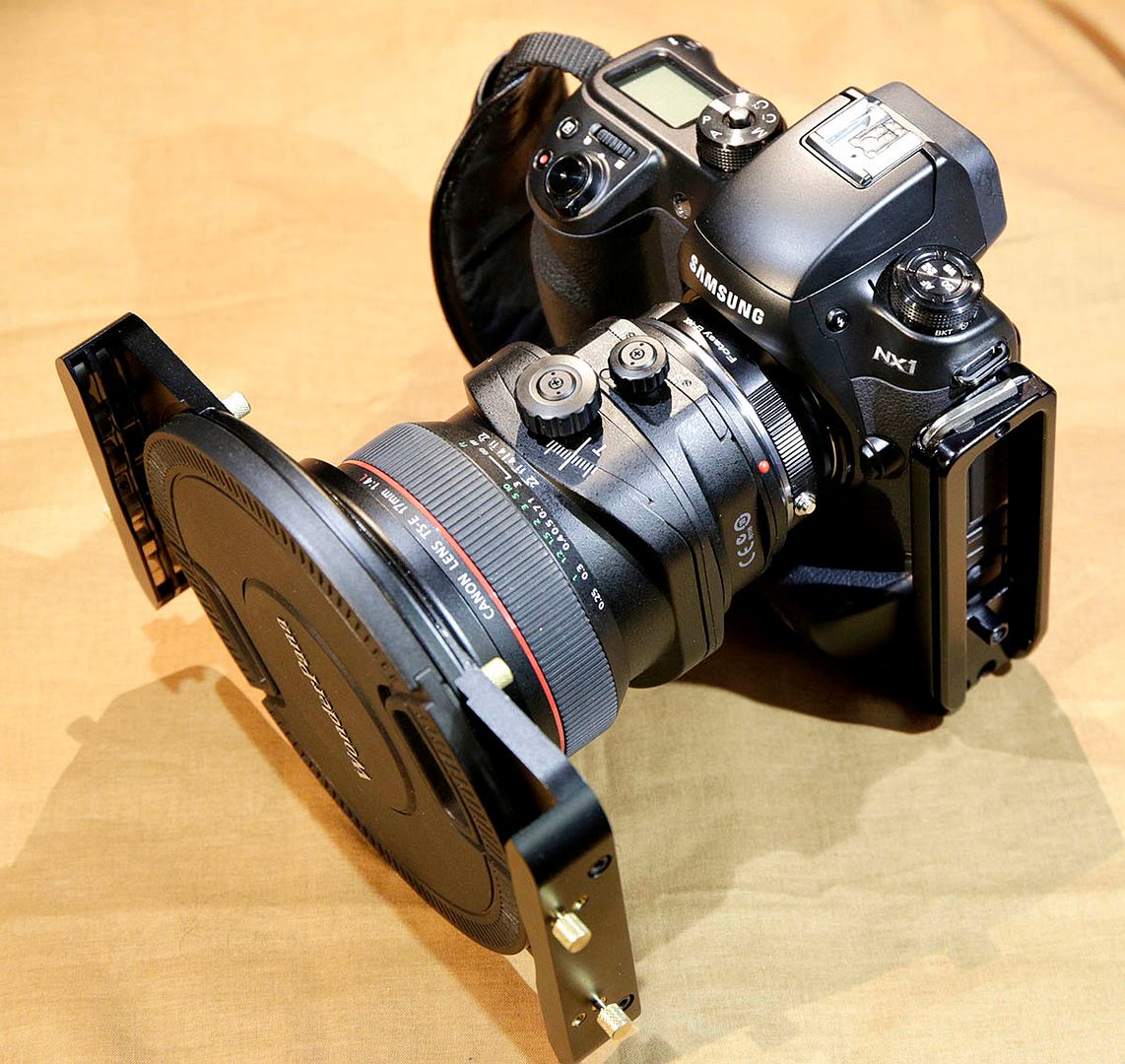 IMAGE: http://i89.photobucket.com/albums/k220/jeffreybehr/Samsung%20NX1/17mm%20TS-E%20lens%20and%20Fotodiox%20WonderPana%20filter/Fotodiox%20amp%2017%20on%20NX1%20L-front%20quarter_1200w_zpsig48saf7.jpg