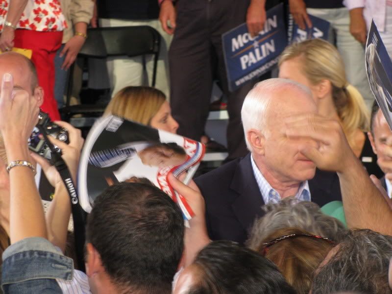McCain face Probably my favorite picture of the whole rally - I took this right as somebody reached out to shake McCains hand, but it looks like theyre grabbing his face